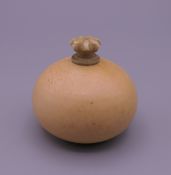 A small 19th century carved ivory snuff bottle formed as a gourd. 3 cm high.