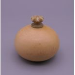 A small 19th century carved ivory snuff bottle formed as a gourd. 3 cm high.