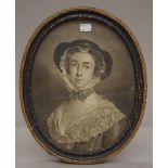 A 19th century print of a Young Lady in an oval carved wooden frame. 35 x 28 cm overall.