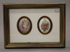 A pair of painted domed porcelain plaques mounted in a common box frame. 38.5 x 28 cm overall.
