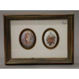 A pair of painted domed porcelain plaques mounted in a common box frame. 38.5 x 28 cm overall.