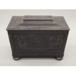 A small 19th century carved oak box. 44.5 cm wide.