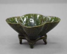 A small Chinese green pottery censer. 10 cm wide.