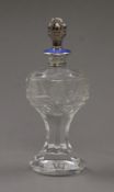 A sterling silver and enamel mounted cut glass scent bottle with silver plated stopper. 21 cm high.