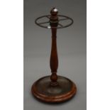 A mahogany and brass stick stand. 60 cm high.