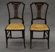 A pair of Victorian inlaid side chairs.