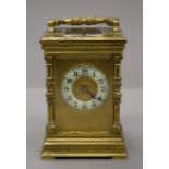 A brass cased repeating carriage clock. 20 cm high.