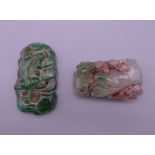 Two Chinese carved jade pendants. The largest 5.75 cm high.