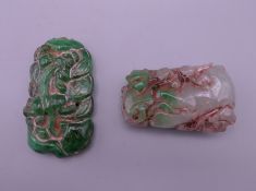 Two Chinese carved jade pendants. The largest 5.75 cm high.