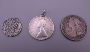 A collection of silver coins, including a Henry VIII silver coin, possibly a groat.