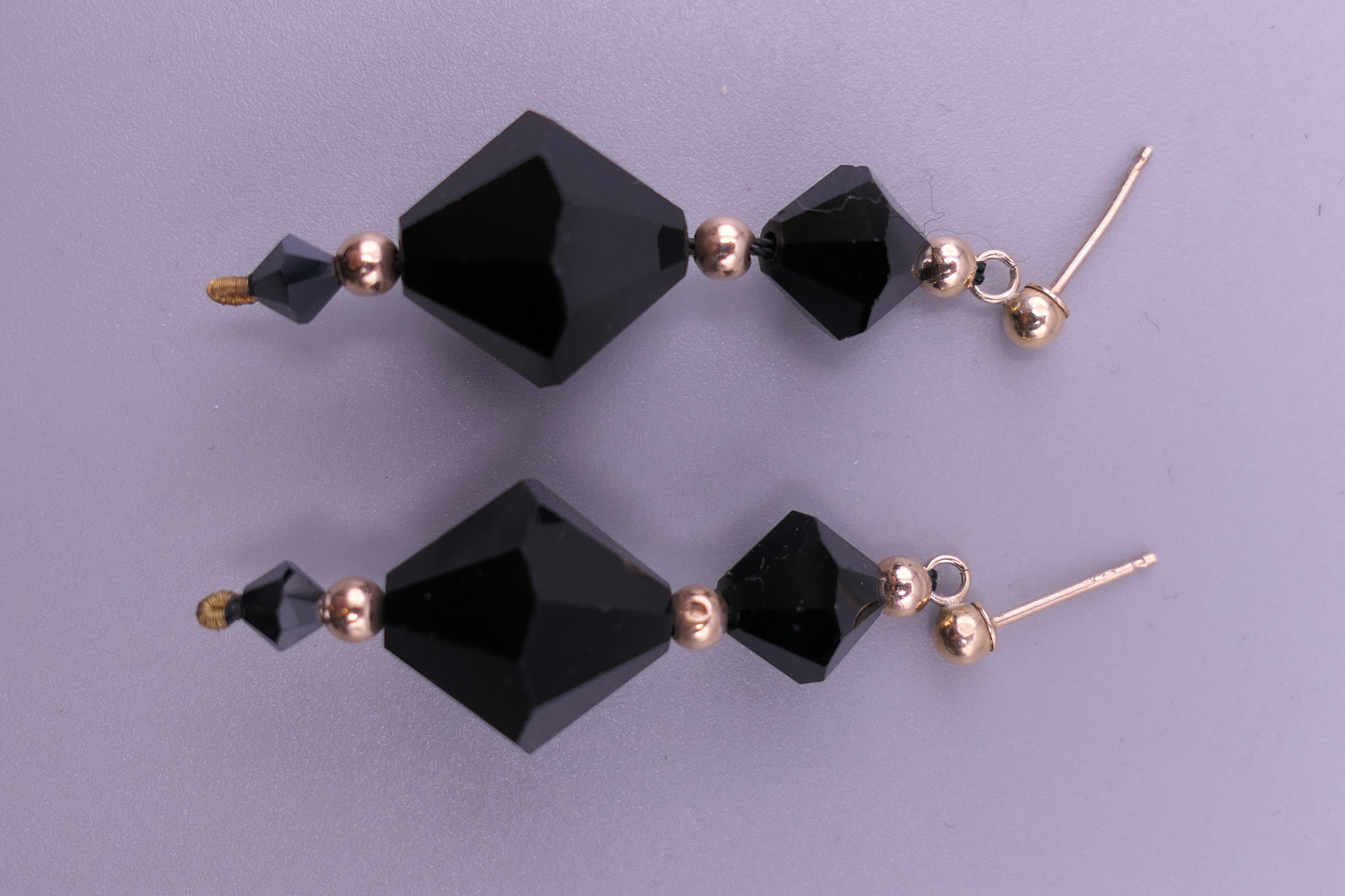 A pair of 9 ct gold mounted Art Deco faceted drop earrings. 3.5 cm high. 5.8 grammes total weight. - Image 3 of 3