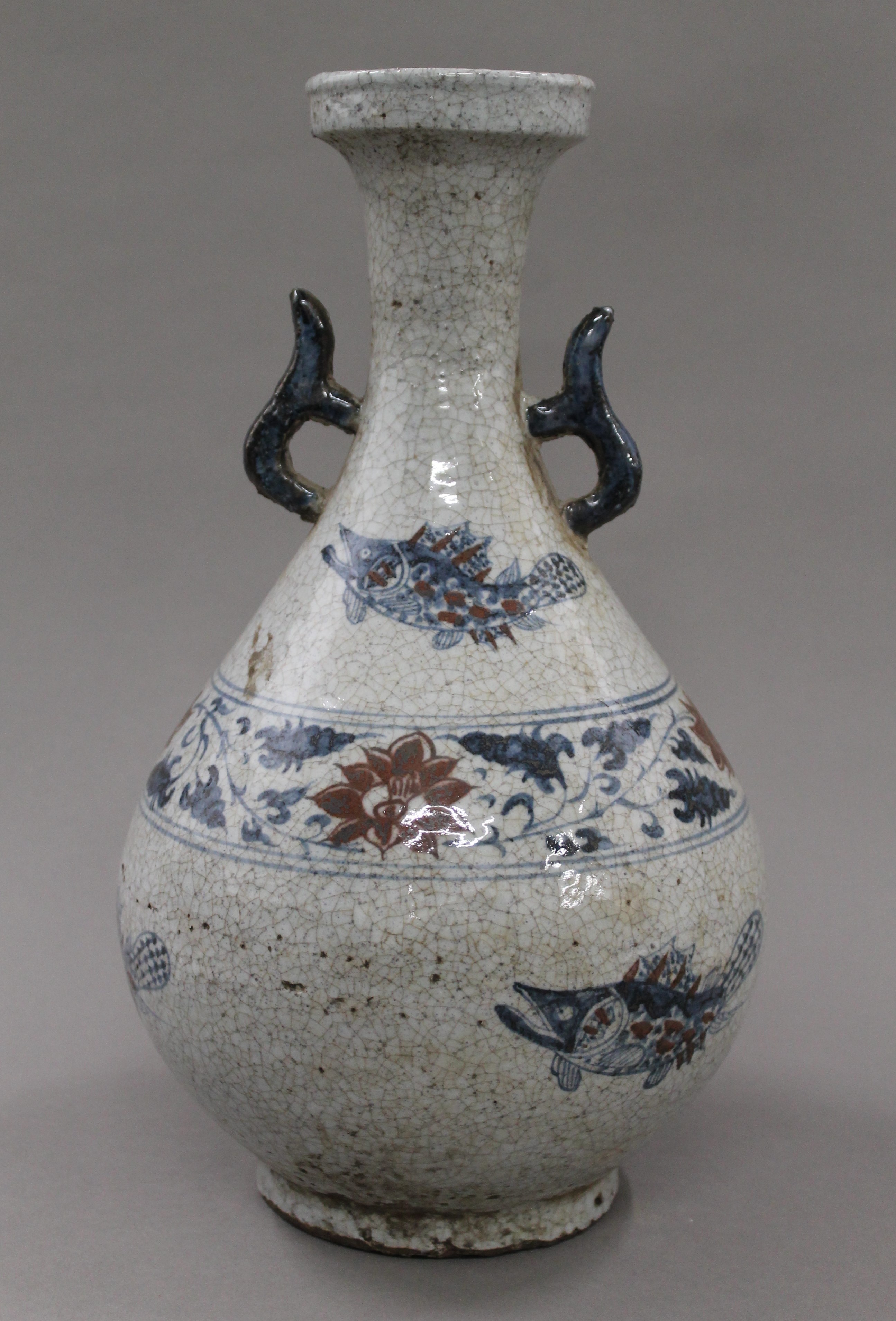 A Chinese blue and brown porcelain vase. 35 cm high.