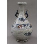 A Chinese blue and brown porcelain vase. 35 cm high.