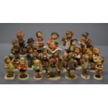 A collection of Hummel figures.