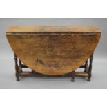 An 18th century oak gate leg table. 120 cm deep.