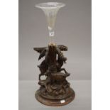 A Blackforest carved centre piece modelled as goats, with a glass flute. 56.5 cm high overall.