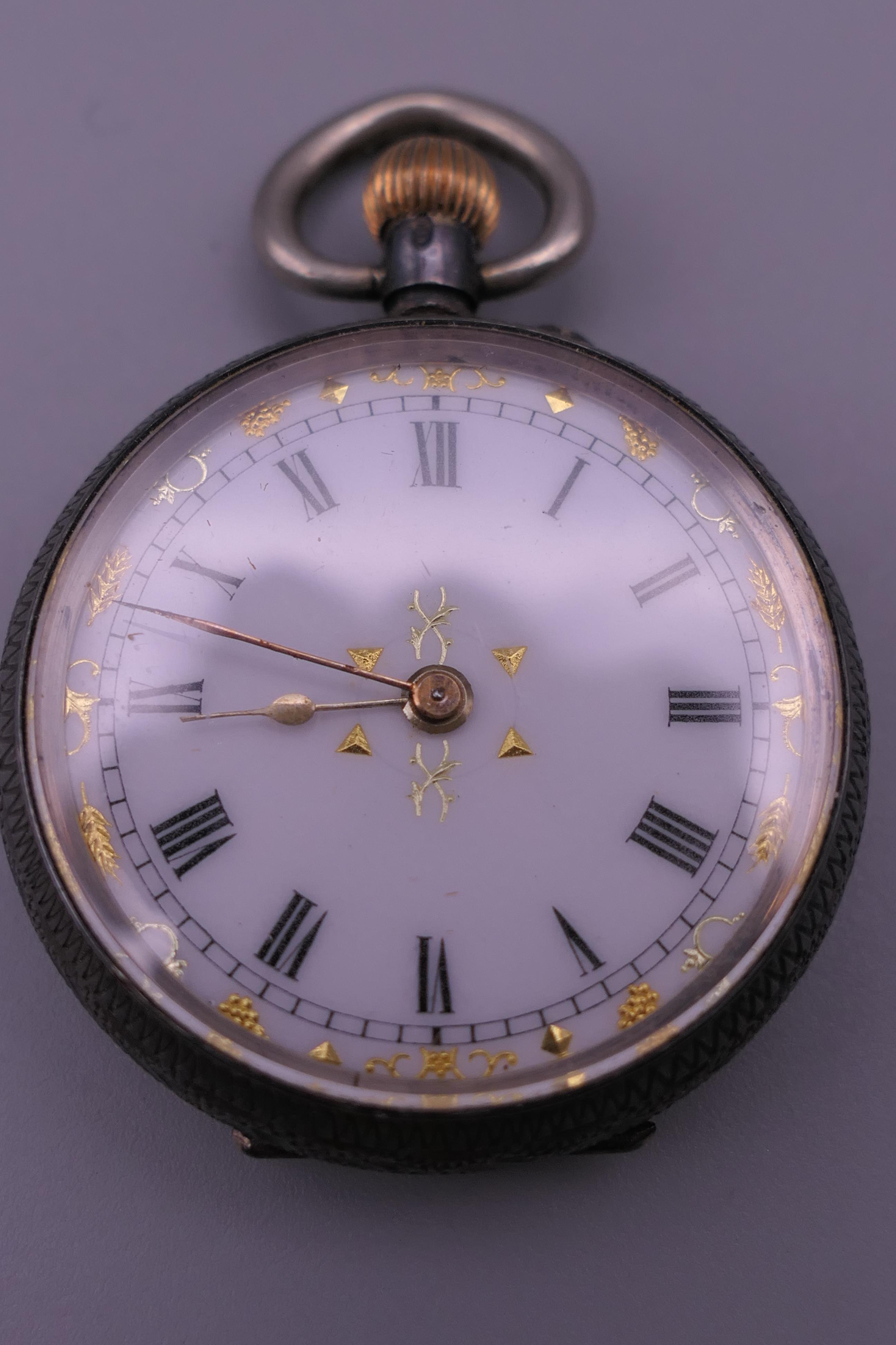 A silver pocket watch, a silver fob watch and a plated pocket watch. - Image 5 of 16