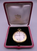 A Cartier 18 K gold open face keyless lever pocket watch, in Cartier box. 5 cm diameter.