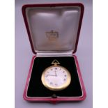 A Cartier 18 K gold open face keyless lever pocket watch, in Cartier box. 5 cm diameter.
