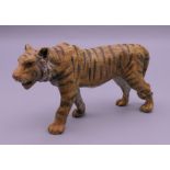 A cold painted bronze model of a tiger. 10 cm long.