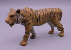 A cold painted bronze model of a tiger. 10 cm long.