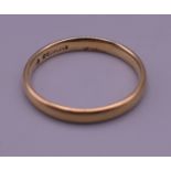 A 9 ct gold wedding band. 1.9 grammes.