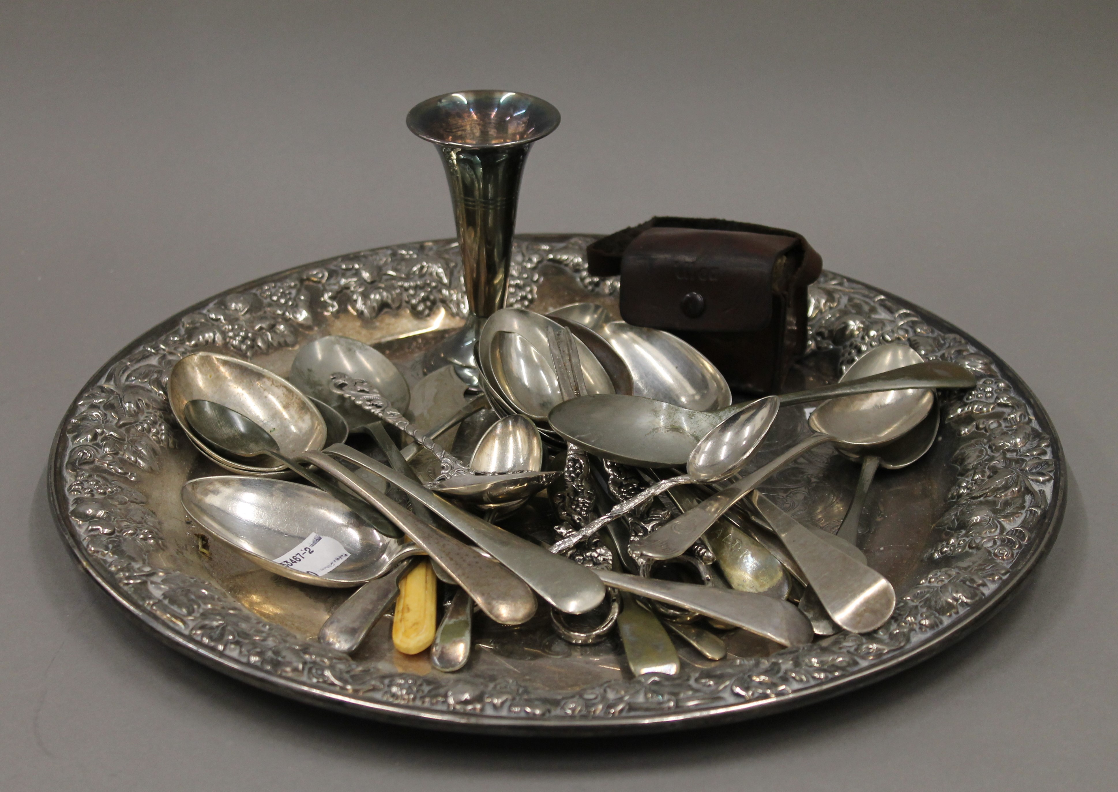 A small quantity of silver plate, an 830 silver spoon and a miniature camera.