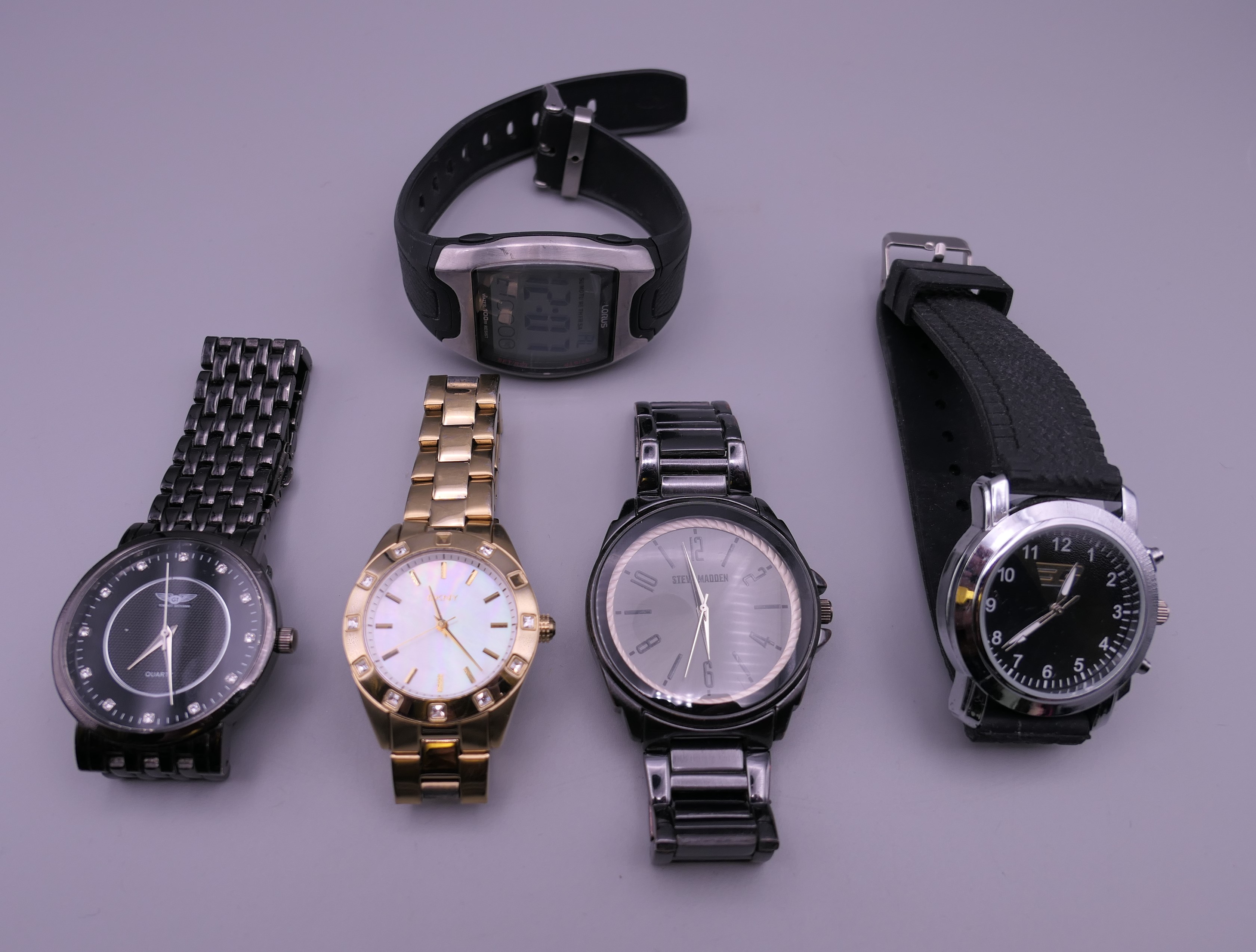 A bag of five wristwatches.