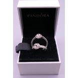 Two silver Pandora rings in a Pandora ring box. Ring size N and J/K.