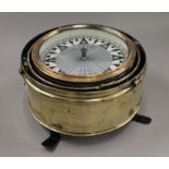 A large 36 cm diameter Kelvin and Hughes brass dry compass/binnacle.