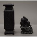 A 19th century Japanese carved basalt vase and a basalt spill vase. The former 28 cm high.