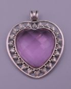 A silver heart pendant. 5.5 cm high.