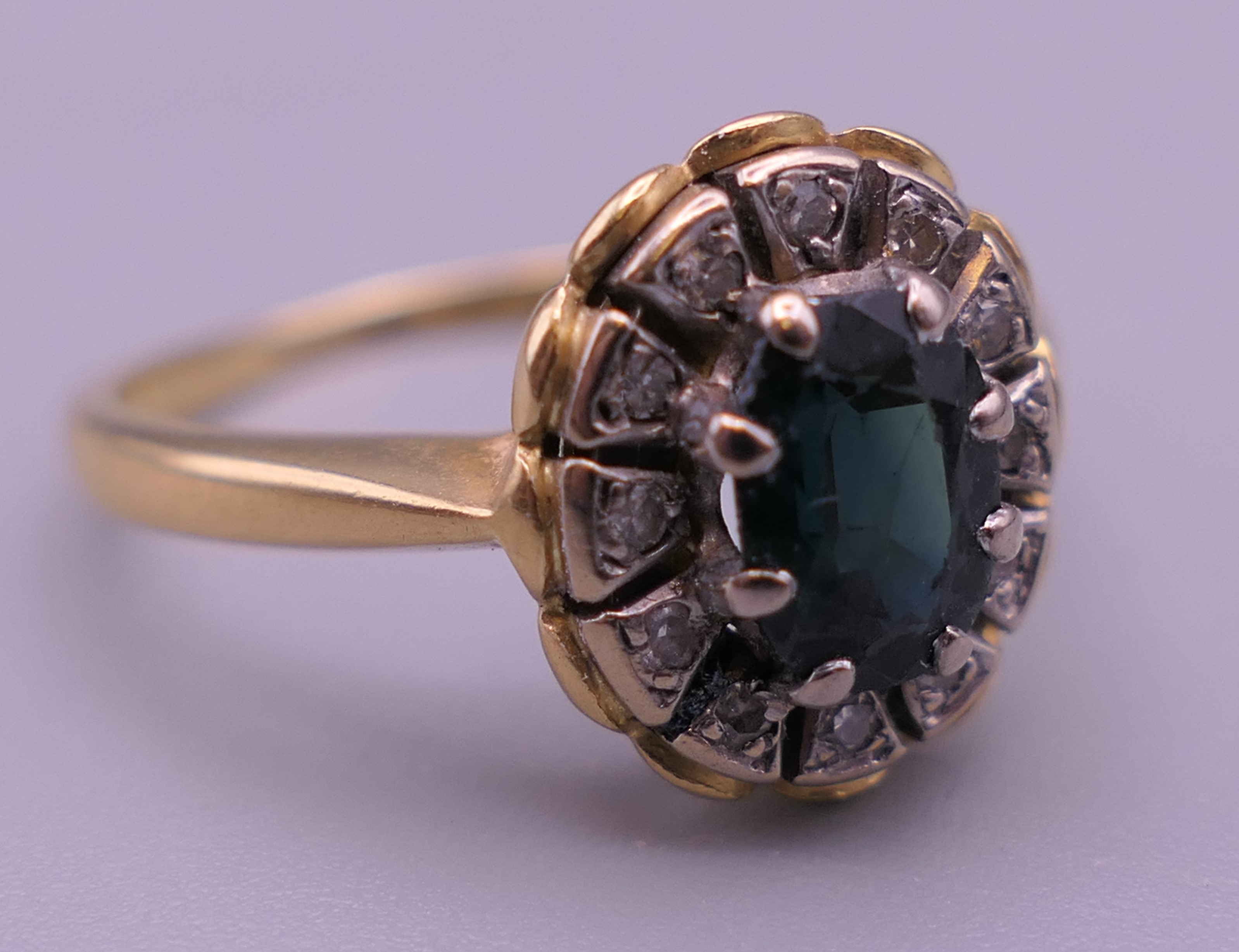 An 18 ct gold diamond and sapphire ring. Ring size P/Q. 4.9 grammes total weight. - Image 4 of 6