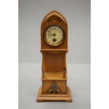 A miniature longcase clock.