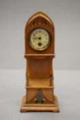 A miniature longcase clock.