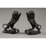 A pair of bronze lion bookends. 19 cm high.