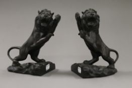A pair of bronze lion bookends. 19 cm high.