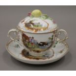 A 19th century Continental porcelain cup, cover and saucer. 12 cm high.