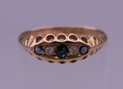 An antique 18 ct gold diamond and sapphire ring, hallmarked Chester. Ring size N. 2.