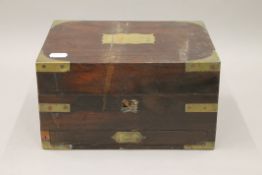 A 19th century brass mounted rosewood travelling box. 26 cm wide.