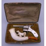 A late 19th century cased cigar cutter and Meerschaum pipe, the cutter formed as a revolver.