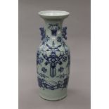 A large 19th century Chinese porcelain vase decorated with various objects. 58 cm high.