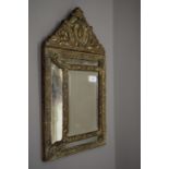 A 19th century pressed brass framed mirror. 32.5 cm wide.