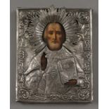 A Russian silver clad religious icon. 18 cm high.