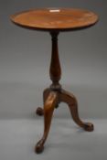 A small mahogany tripod table. 49.5 cm high.