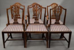 Seven various shield back dining chairs.