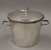 A Harrod's of London silver plated ice bucket. 17 cm high.
