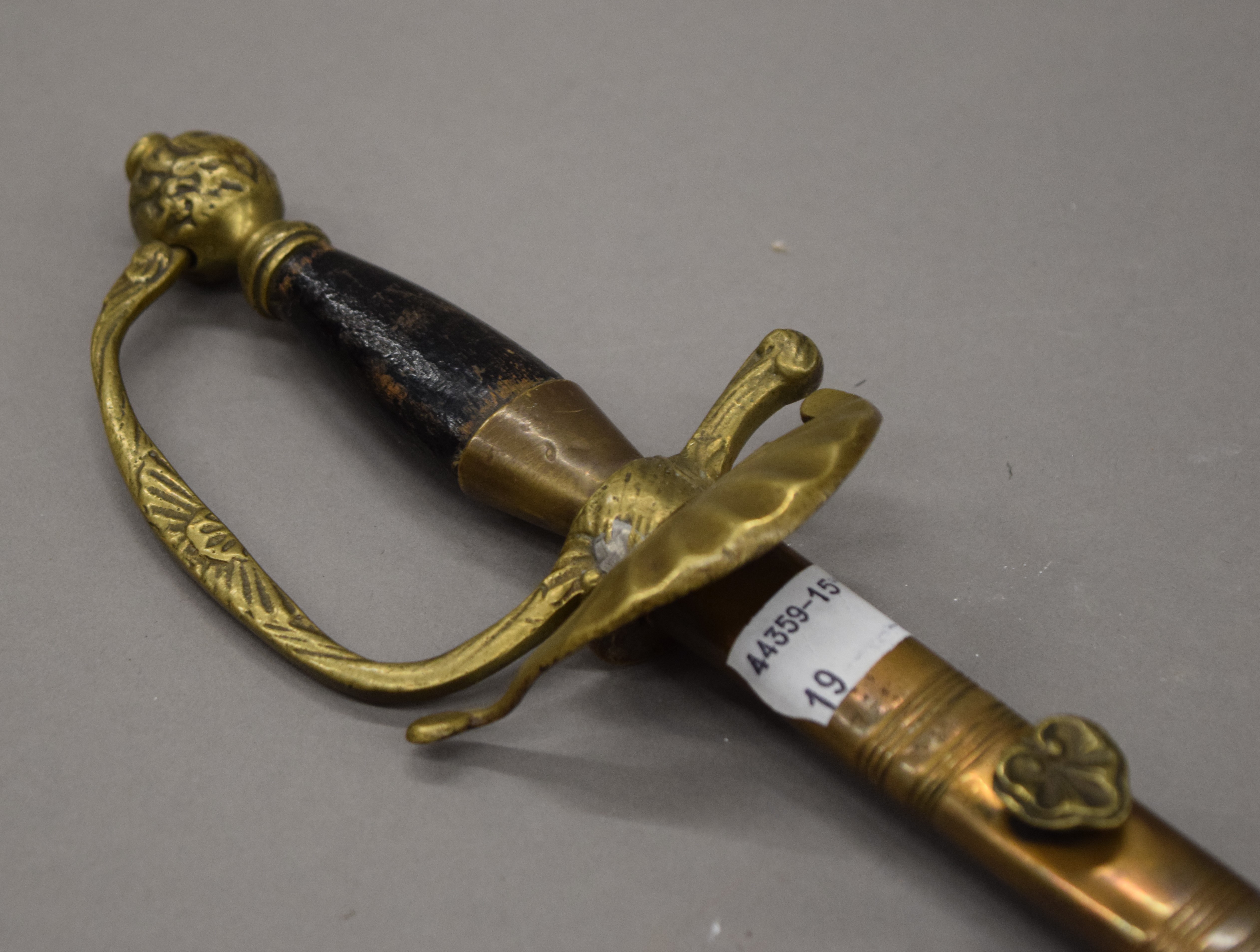 A Victorian bandsman sword in scabbard. 69 cm long. - Image 2 of 4