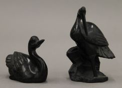 A carved stone model of a crane and a duck. The former 9 cm high.