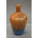 An orange and blue glass vase with gold flecks. 32 cm high.